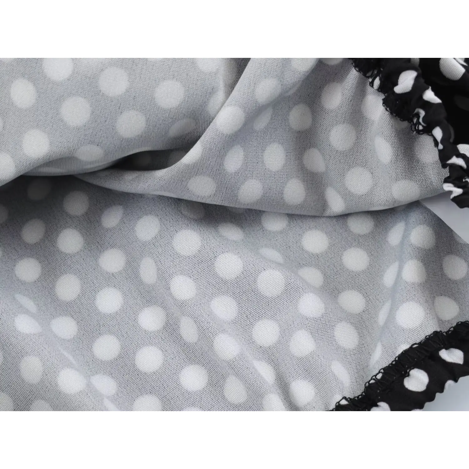 Skirt hem inner lining partial shot, outer polka dot woven + solid light gray smooth lining