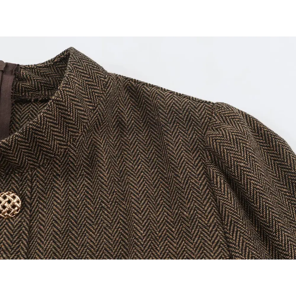 Close-up of puffed shoulder and herringbone fabric