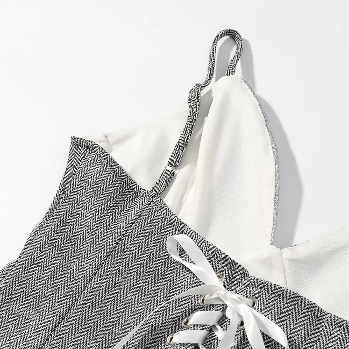 View of the bust area on the cami top, showing the silver glitter V-shaped cups, herringbone side panels, and matching woven straps