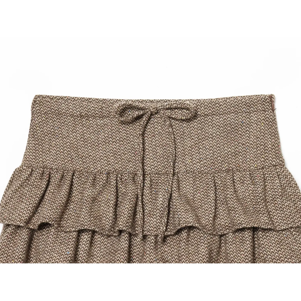 Close-up of waistband tie bow and side zip