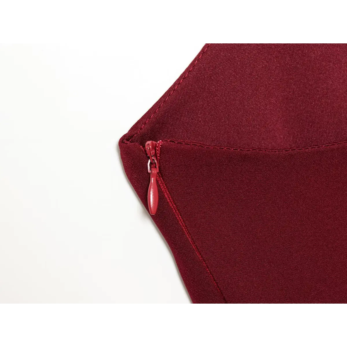 Close-up of the hidden side zipper on a wine red corset sequin dress, showing the fabric-covered pull and seamless stitching.
