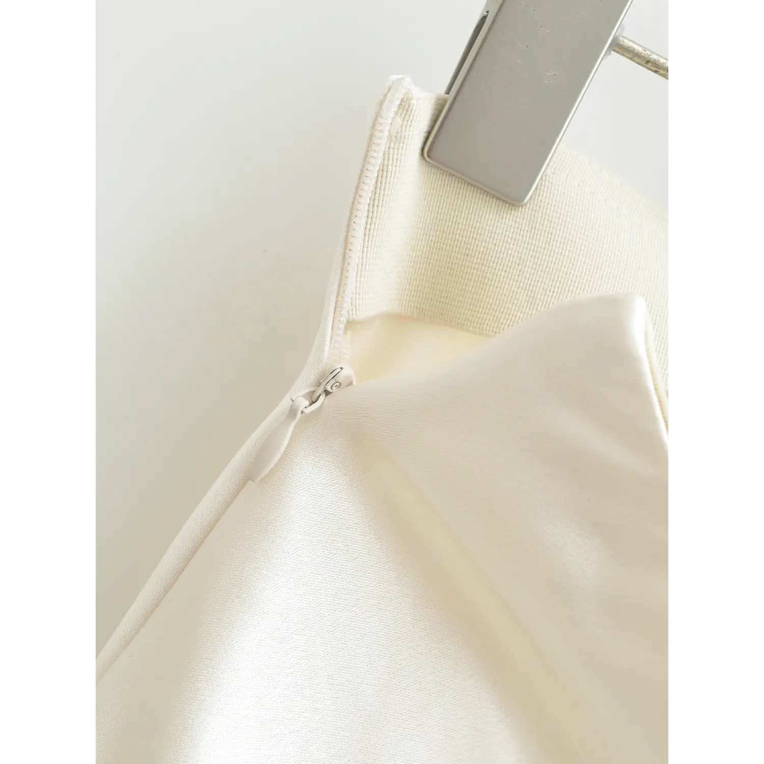 Full hidden side zipper macro shot, invisible design keep skirt intact wrapped zipper pull fit fabric sewing detail shot