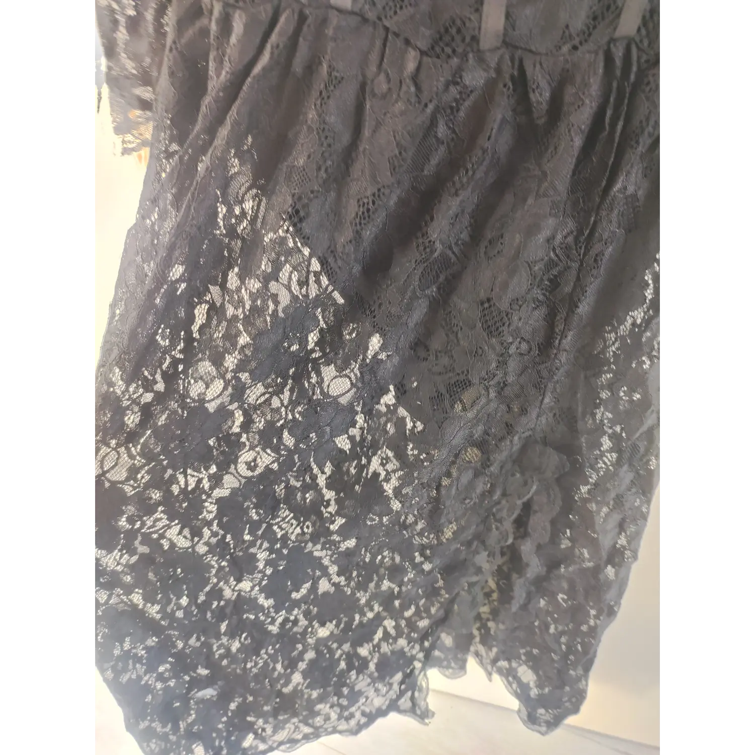 High waist gathered skirt section, allover black floral lace fabric close-up, maxi dress | Detail