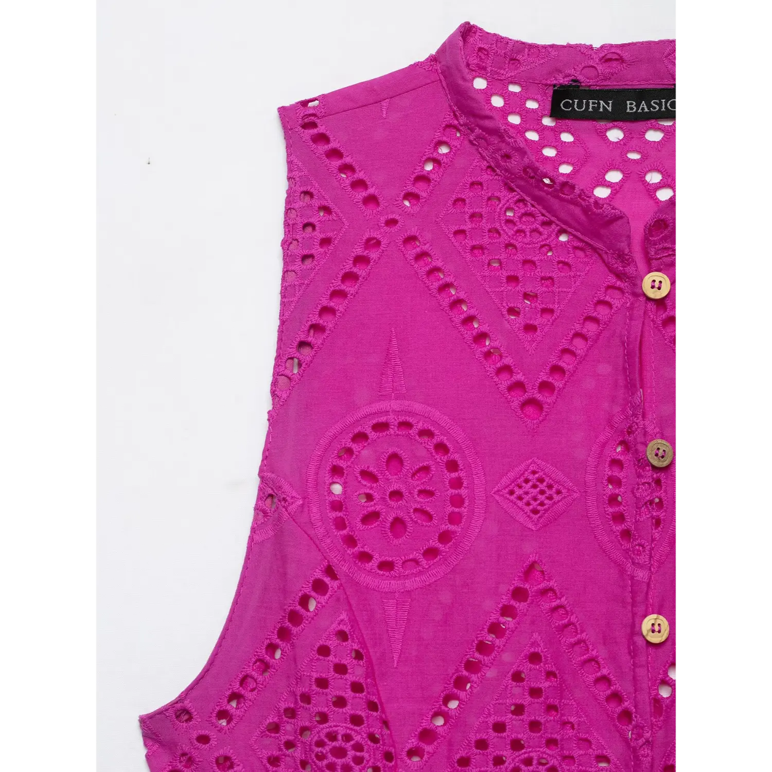 Stand collar and eyelet fabric close-up of hot pink sleeveless peplum top