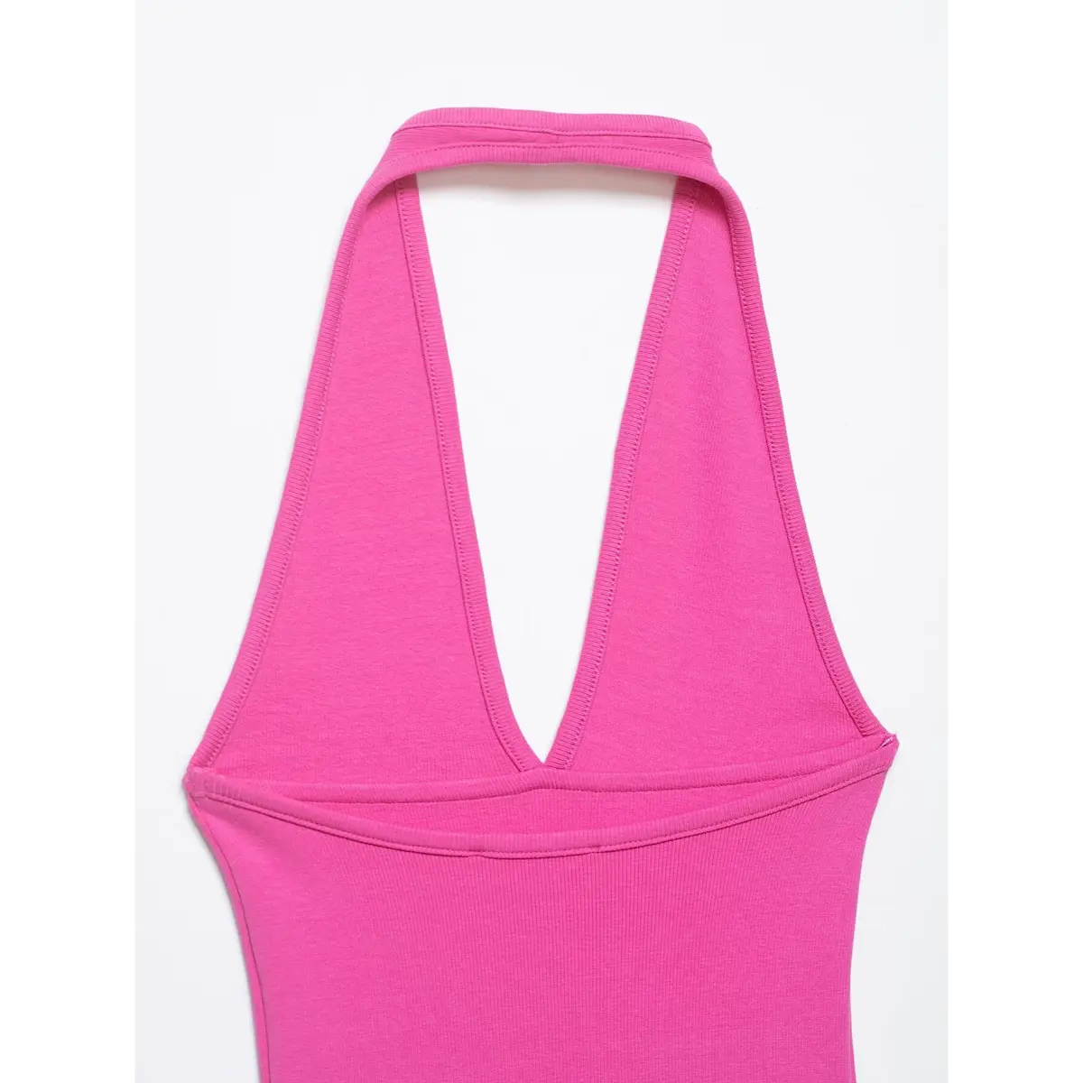 Back view of the pink halter top, showcasing the halter strap design, V-neck back construction, and detailed stitching.