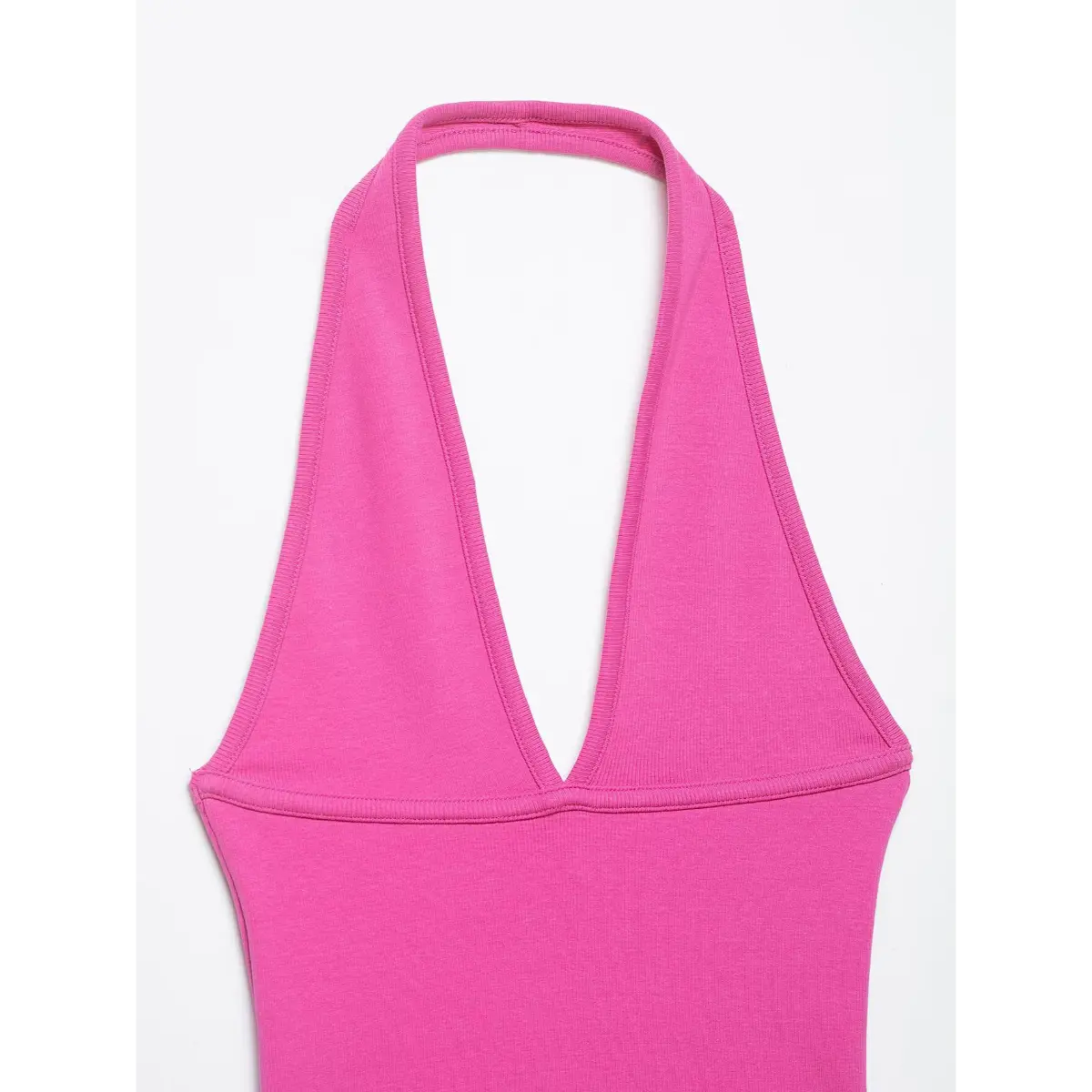 Full back view of the pink halter top, displaying the halter neck strap, deep V-back design, and ribbed fabric fit.