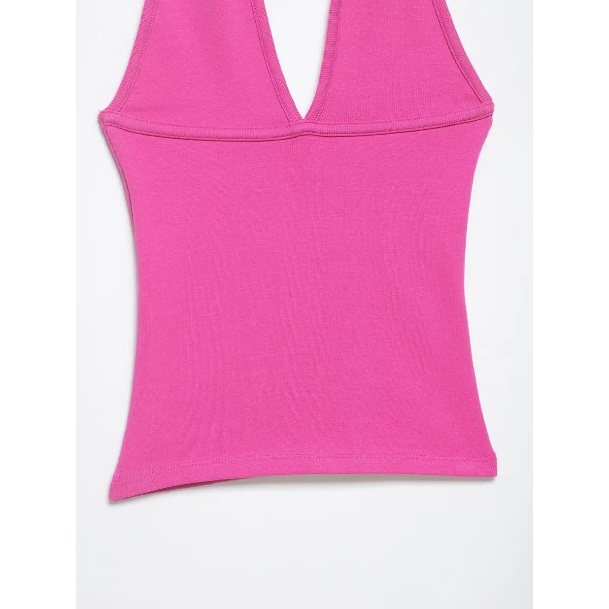 Full front view of the hot pink halter top, displaying its form-fitting silhouette, stretchy ribbed knit, and clean bottom hem.