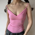 Bright hot pink form-fitting camisole tank top front view, deep V neck side ruched stretch knit thin adjustable straps casual women inner top