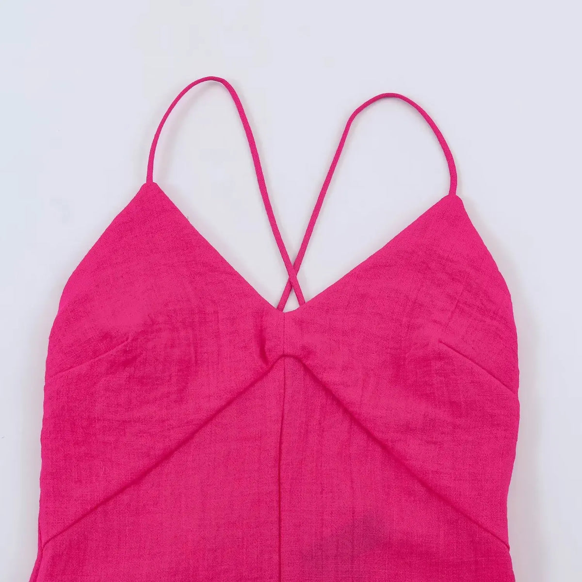 Close-up of V-neck twist front and thin spaghetti straps