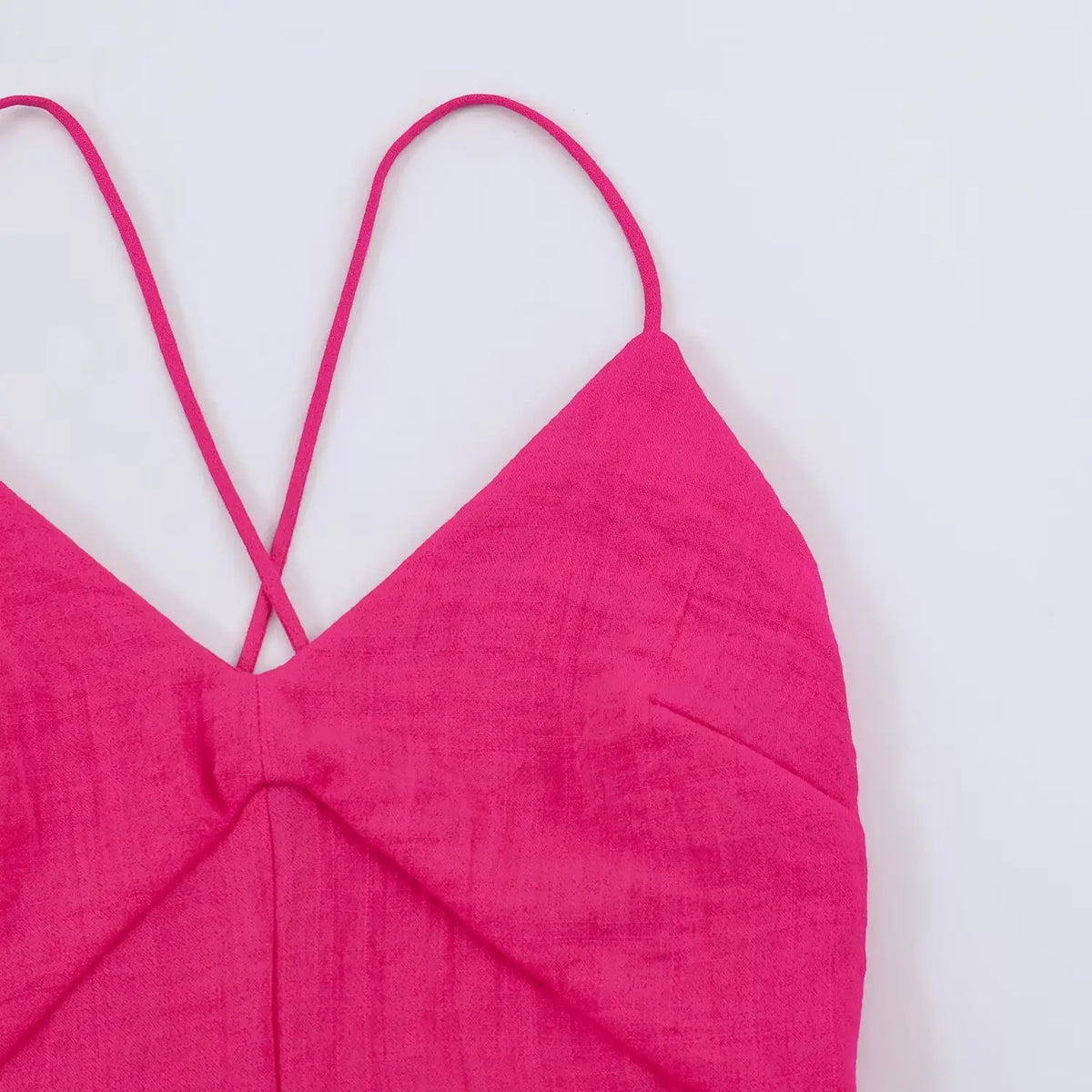 Close-up of spaghetti strap and V-neckline