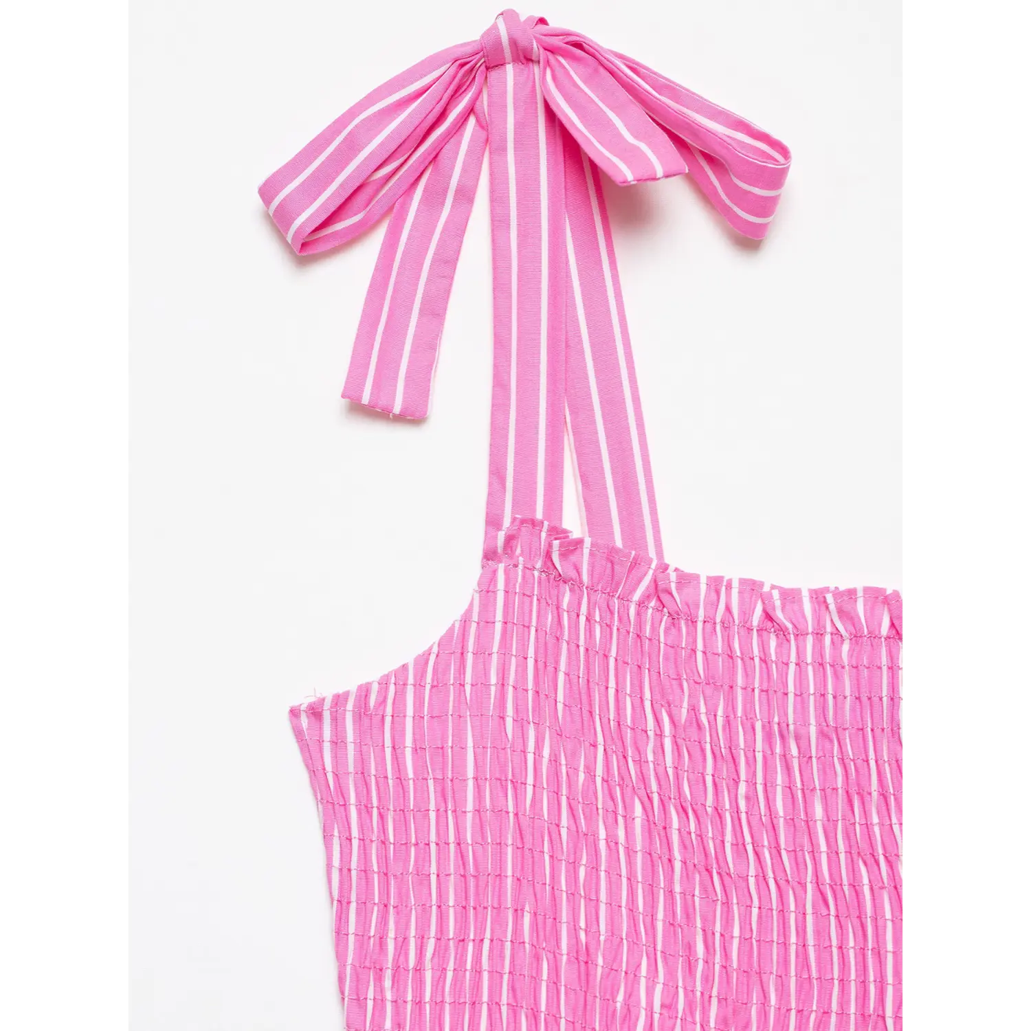 Close‑up of hot pink white vertical stripe fabric tie bow shoulder strap and smocked bodice detail