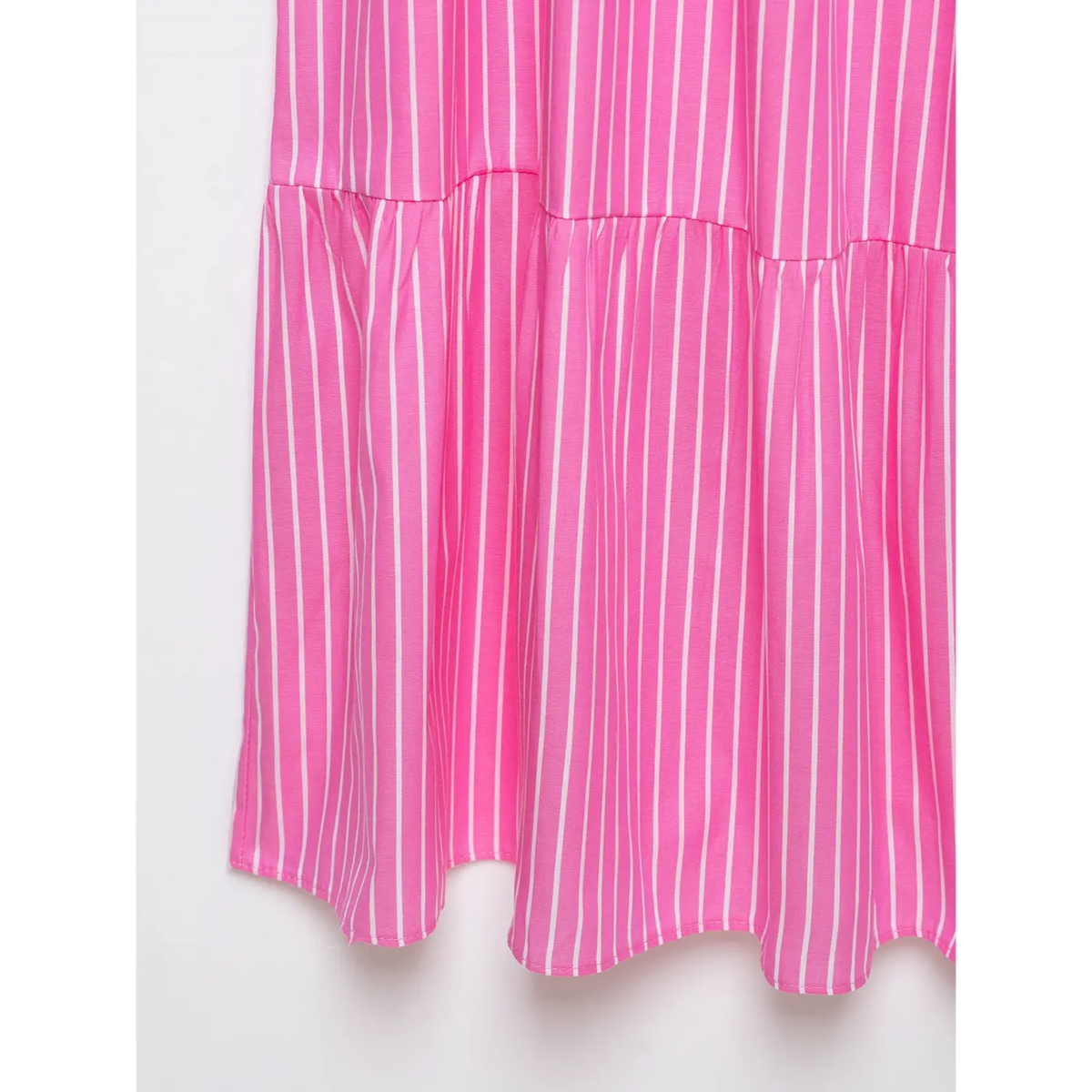 Partial shot of hot pink vertical stripe flowy skirt fabric