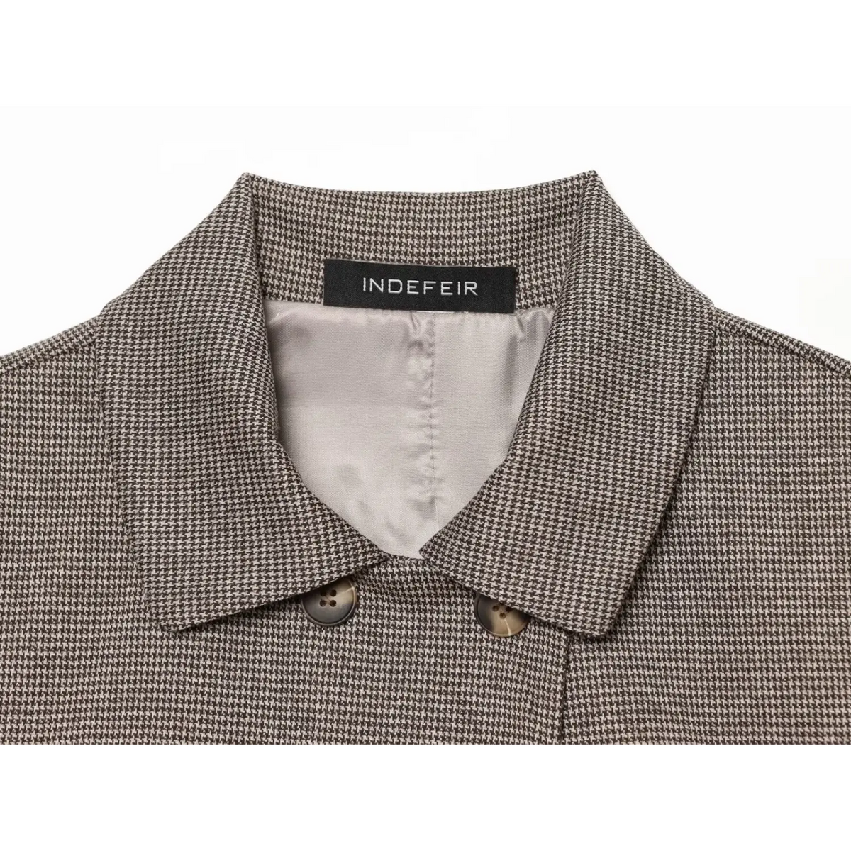 Close-up of collar lining and brand label
