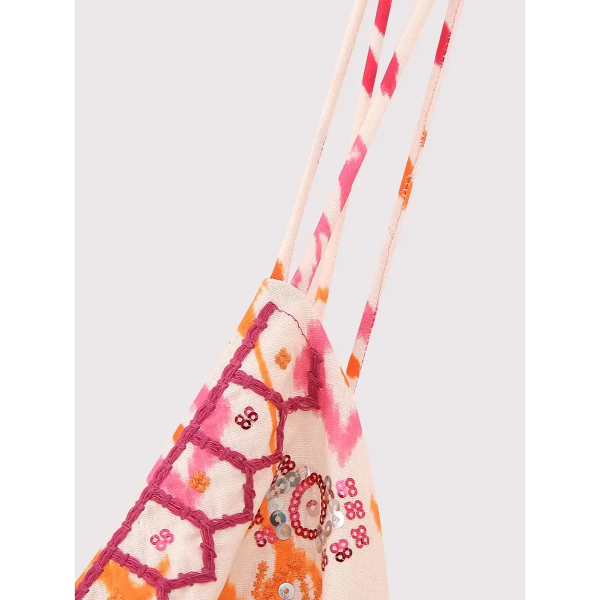 Close-up of the straps on the ikat print cami top, showing the double spaghetti straps, pink embroidery, and sequin embellishments