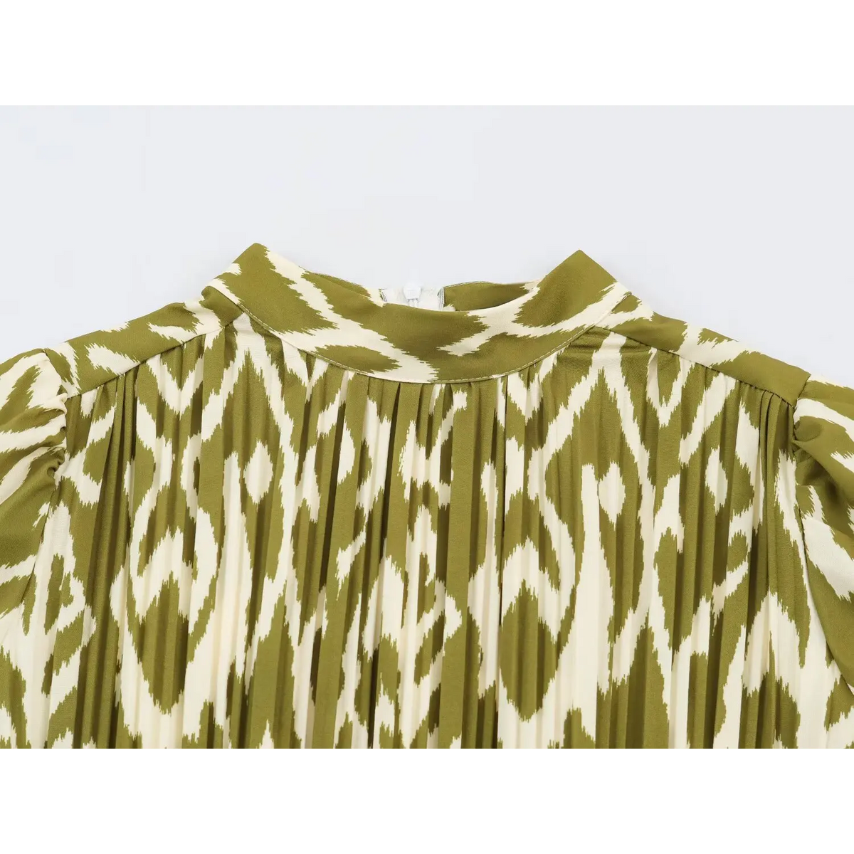 Close-up of high neckline and vertical pleated bodice