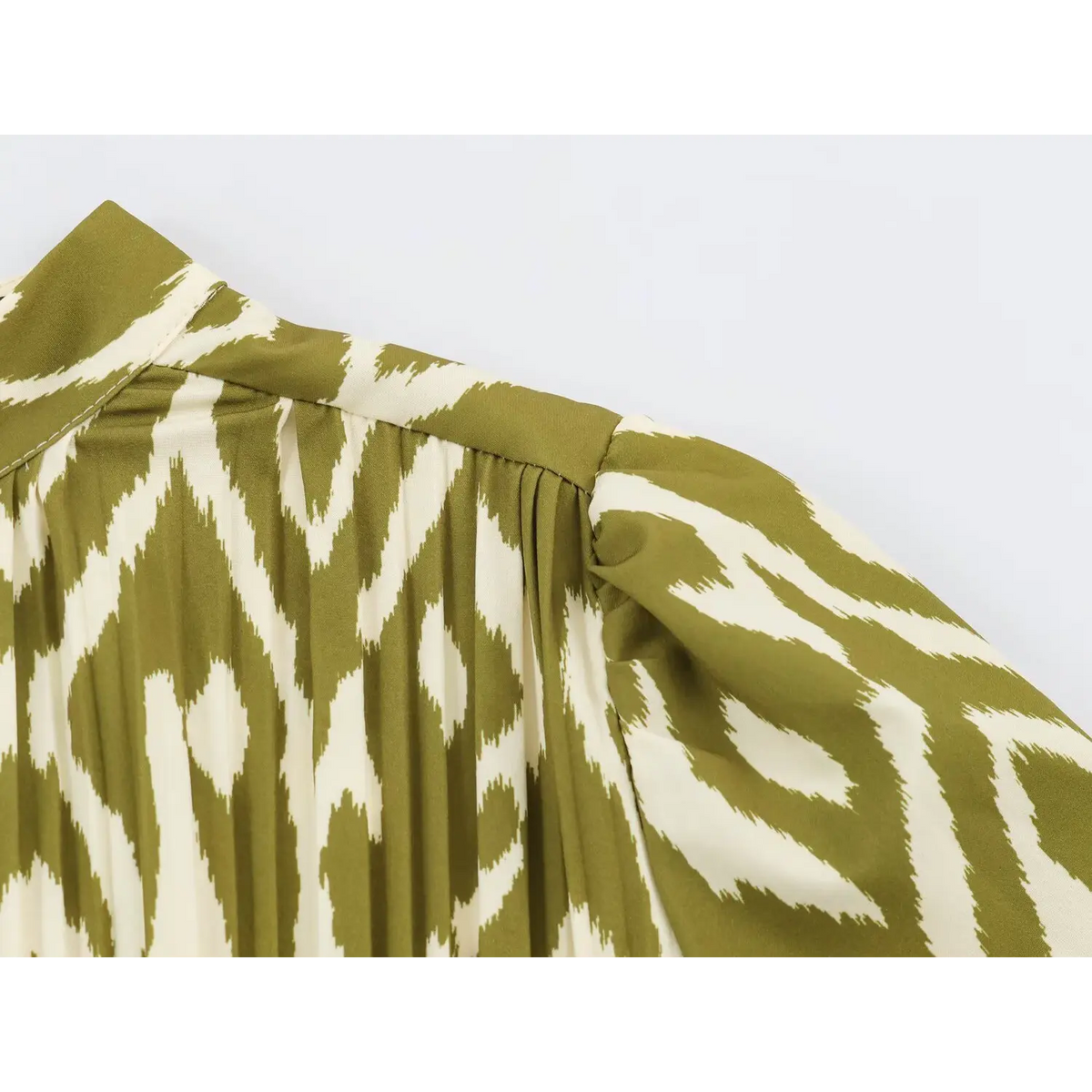 Close-up of shoulder seam and gathered pleats