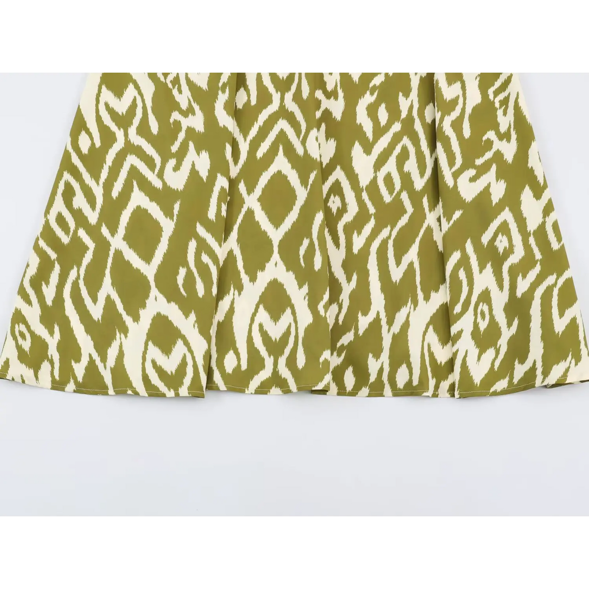 Close-up of A-line midi skirt and ikat print