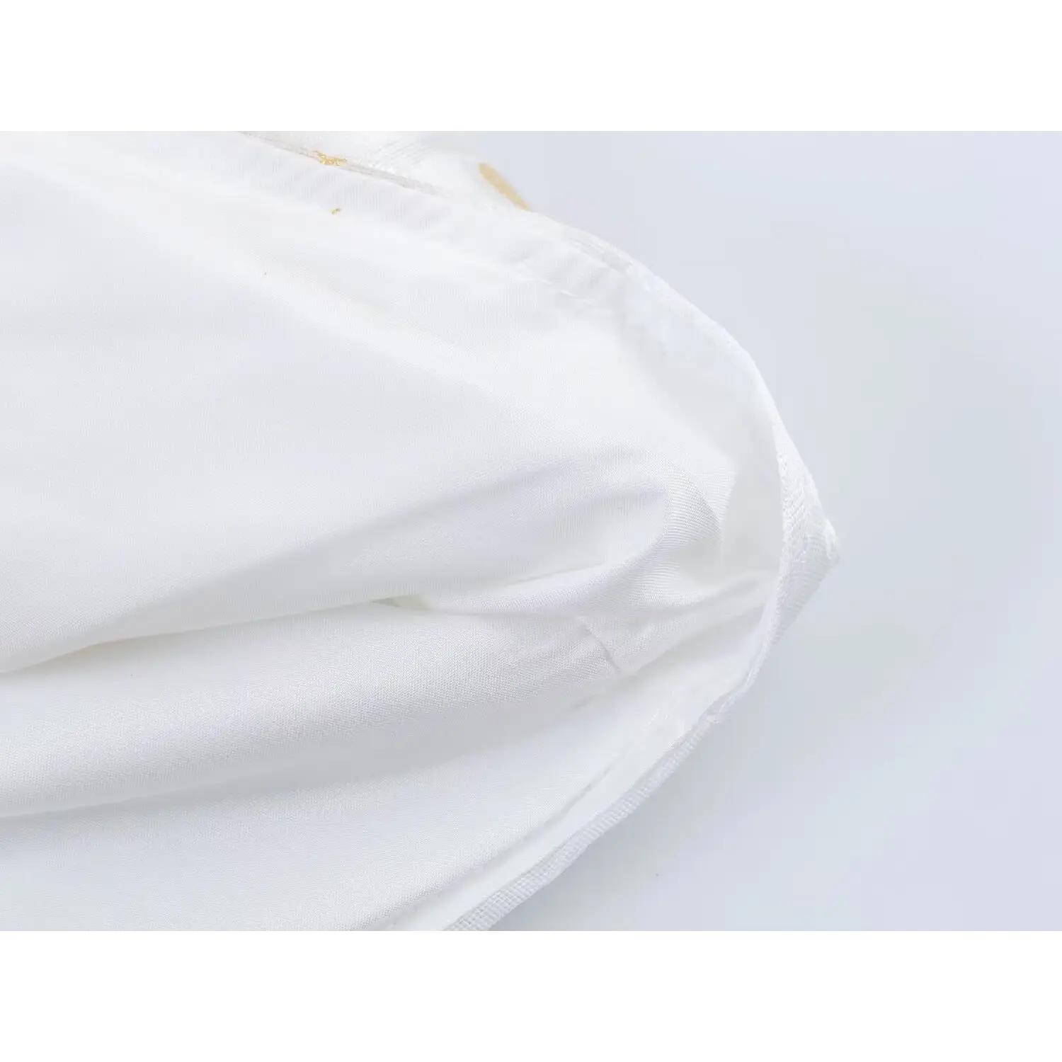 Dress inner lining partial shot, neat folded hem stitching, smooth solid white lining fabric, clean seam workmanship
