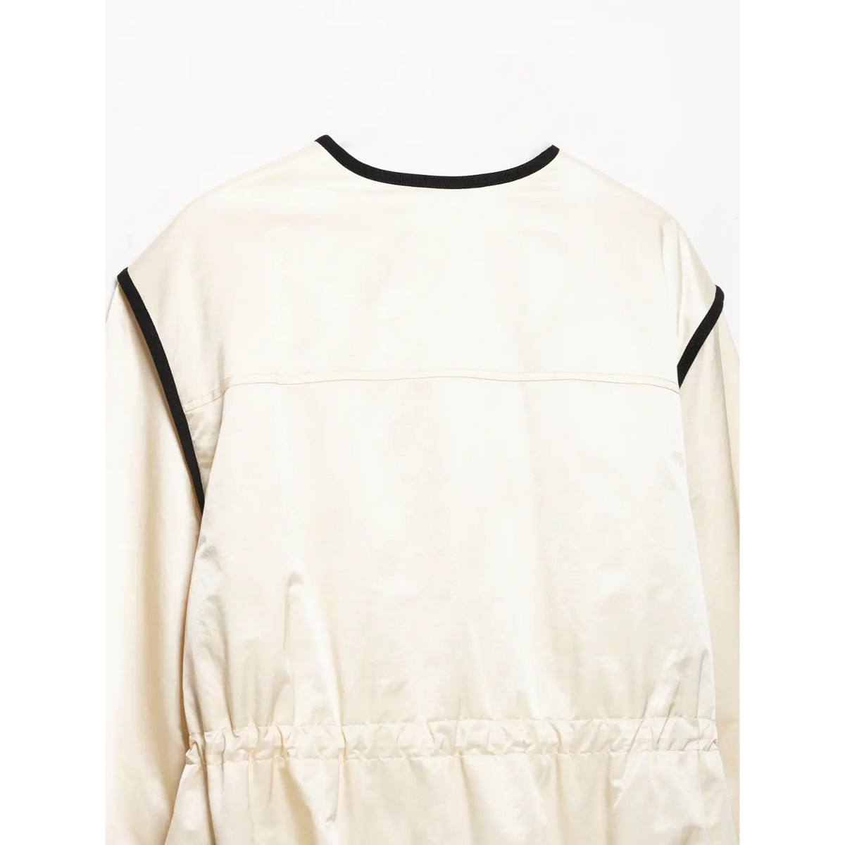 Close-up of back neckline, shoulder seam and gathered waist