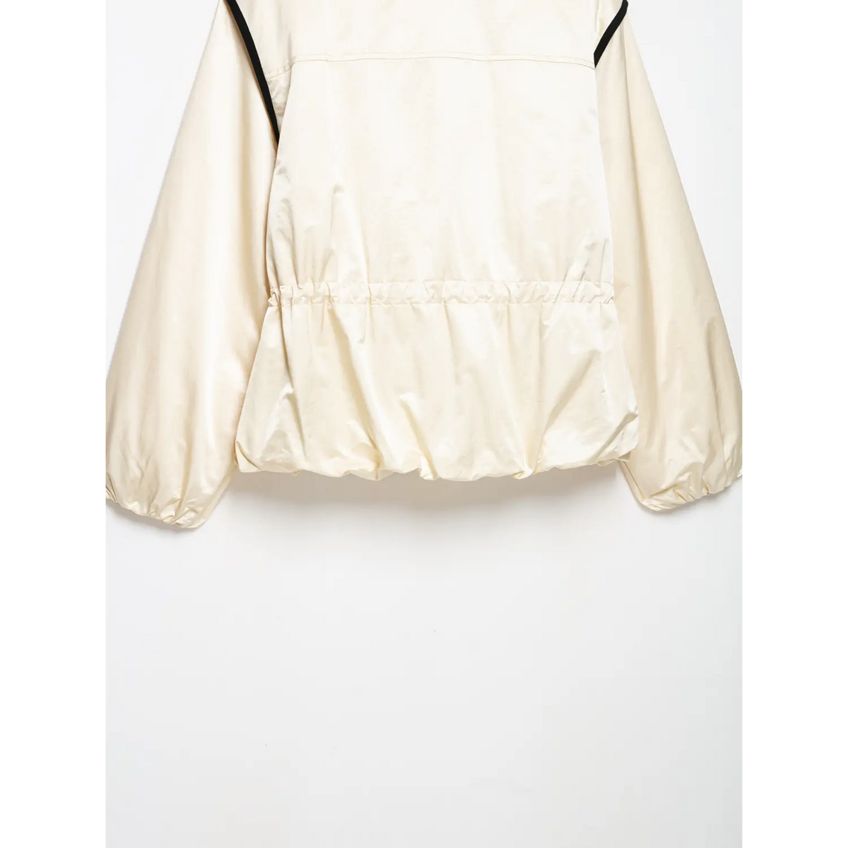 Close-up of back gathered waist, bubble hem and puff sleeves