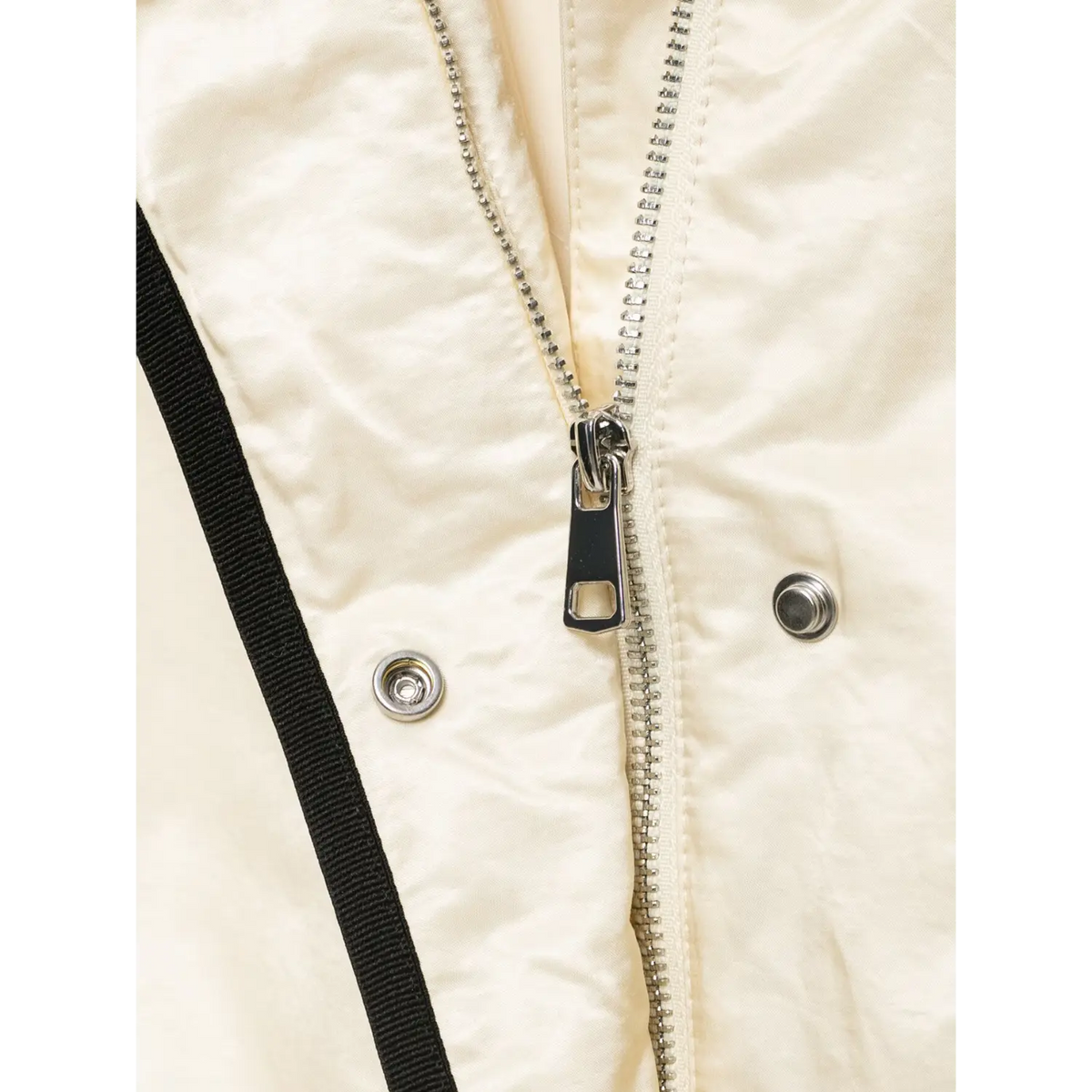 Close-up of inner metal zipper and snap buttons