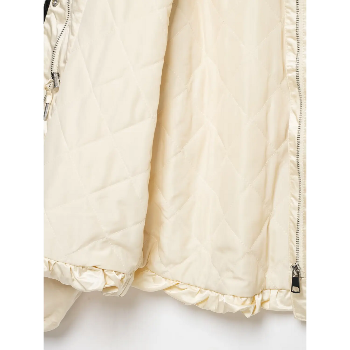 Close-up of diamond quilted lining and gathered hem