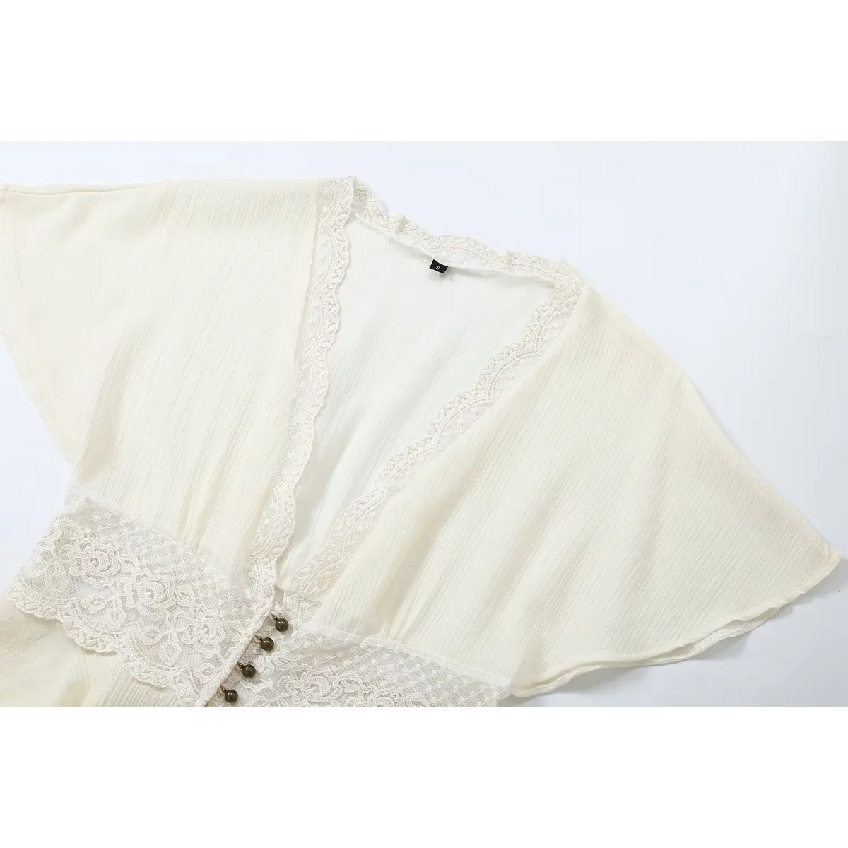 Close-up of V neck lace trim and waist lace panel