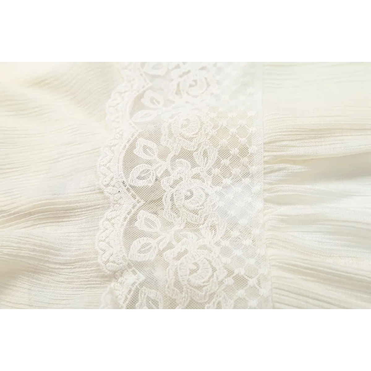 Close-up of waist lace panel and crinkled chiffon