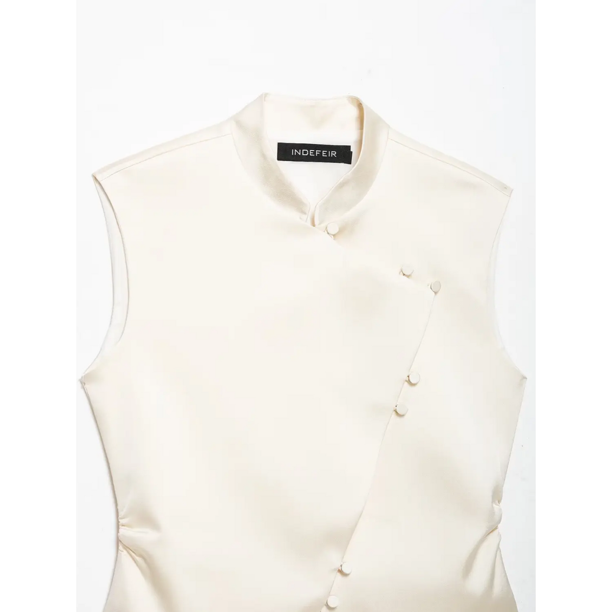 Close-up of mandarin collar and asymmetric placket