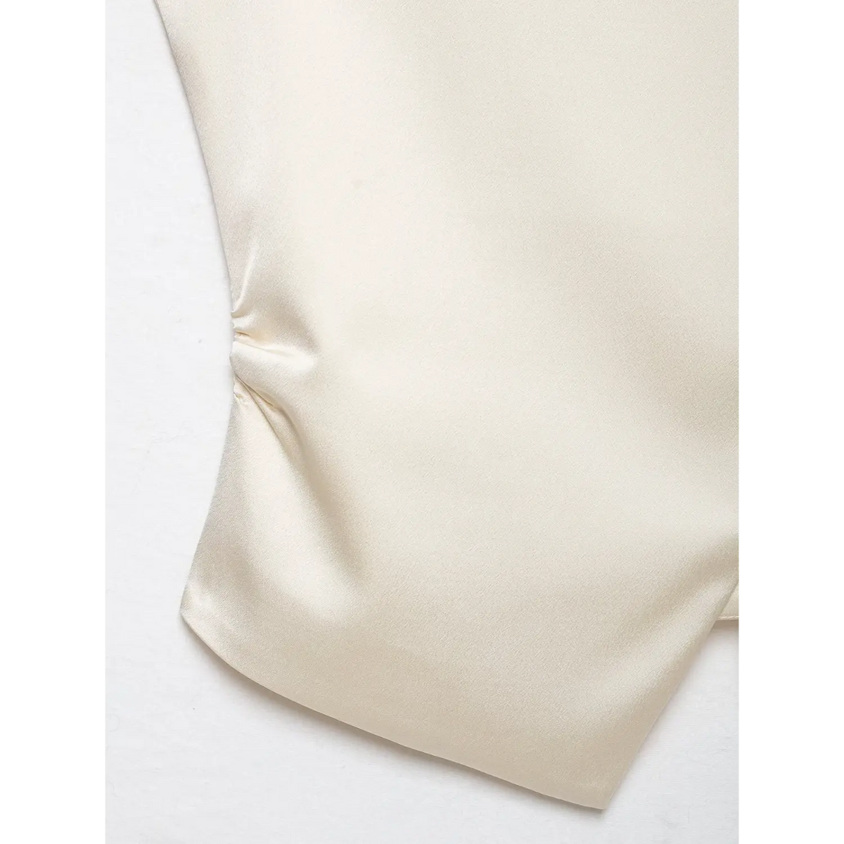 Close-up of side ruching and satin fabric