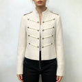 Model wearing ivory military cropped jacket with black trousers