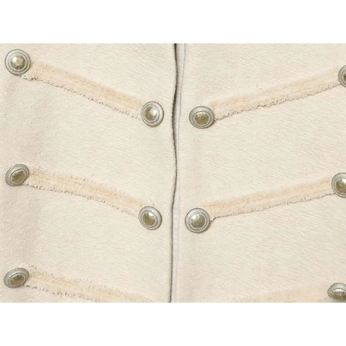 Close-up of four rows of braided button trim on ivory military jacket