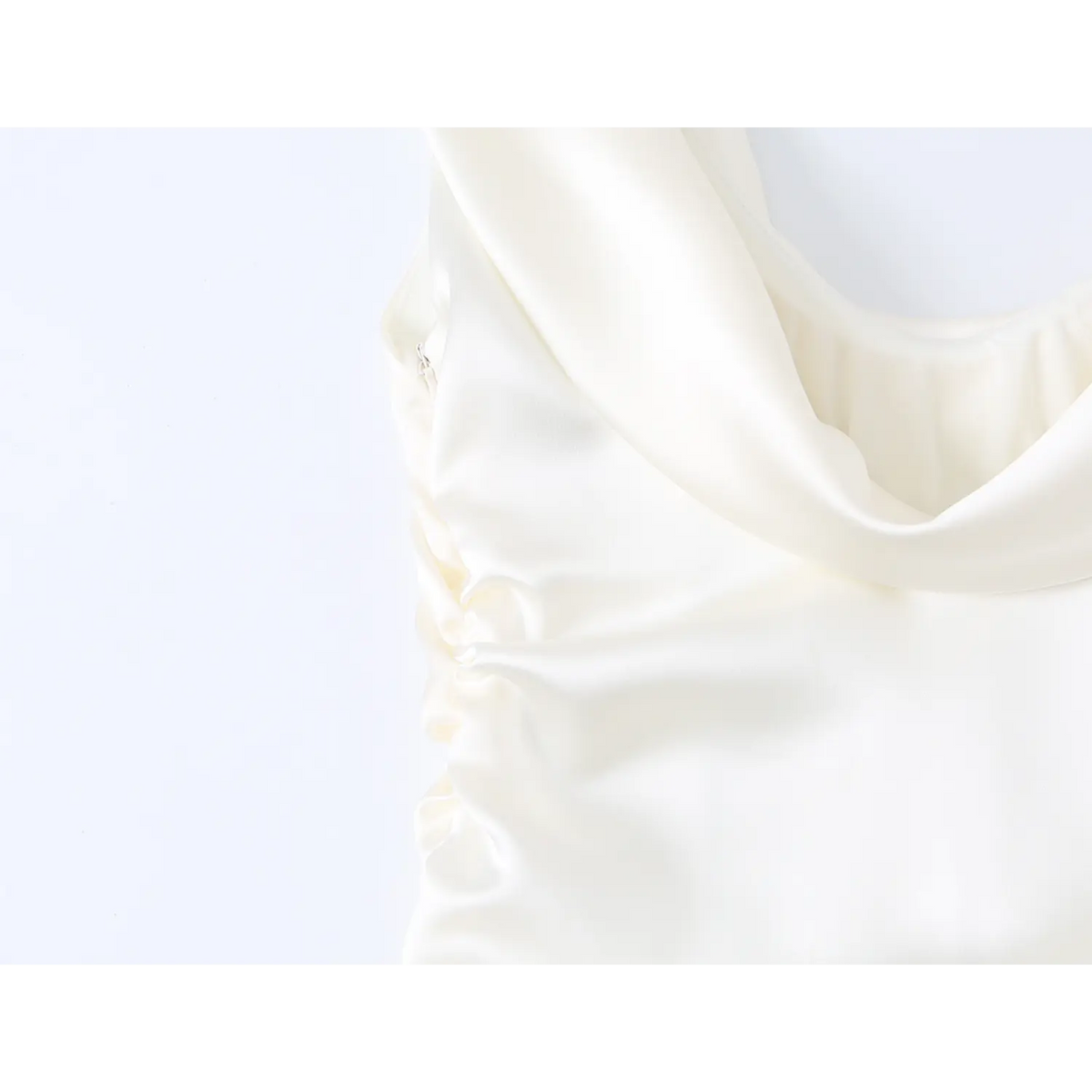 Close-up of side zip and ruched waist