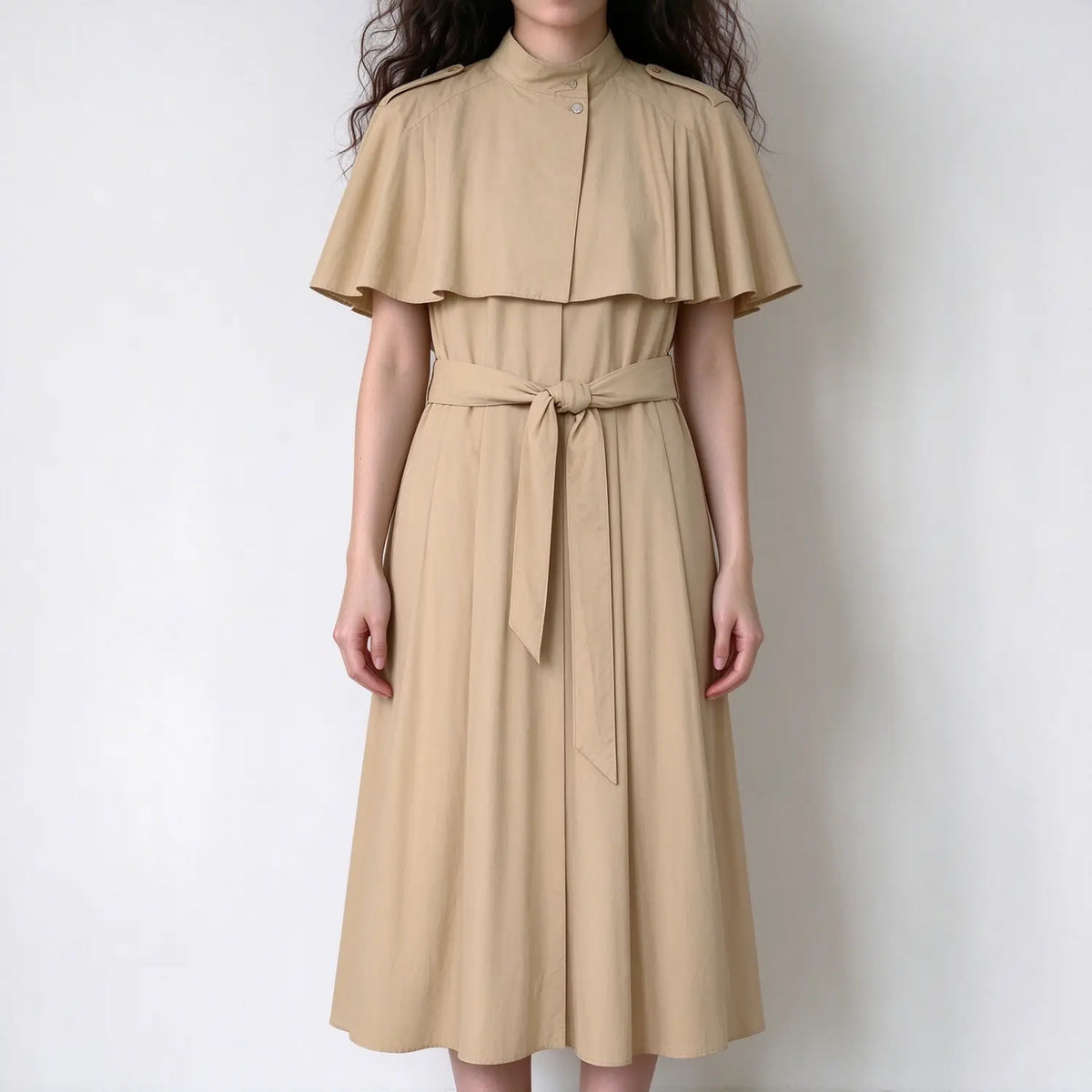 Model wearing khaki belted cape shoulder midi dress, front view