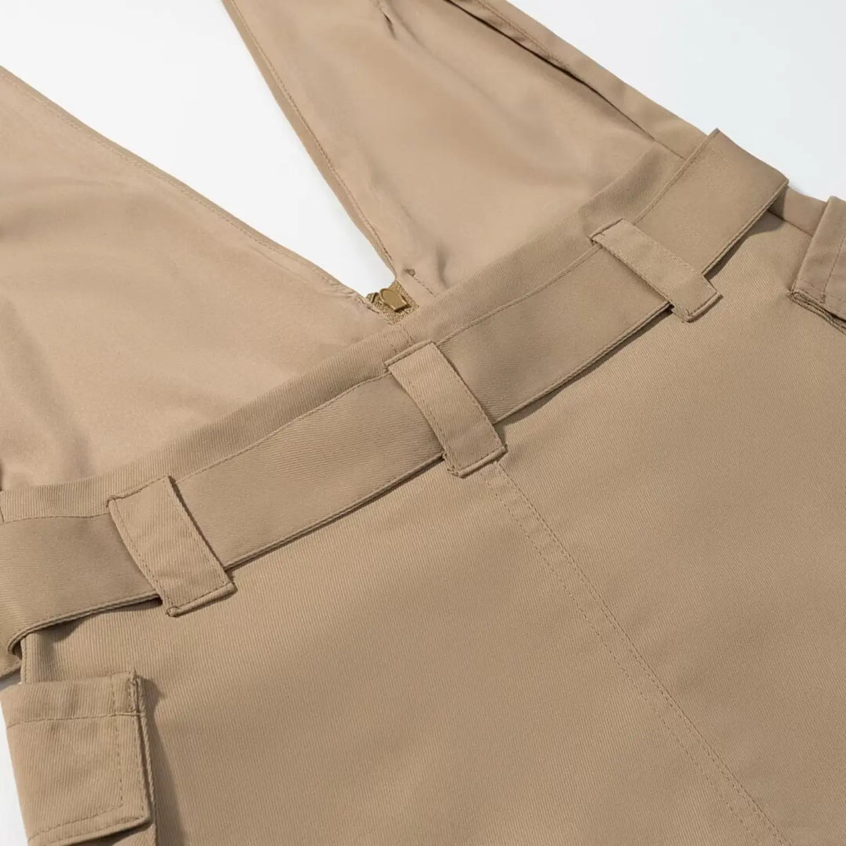 Close-up of khaki belt loops and back zipper