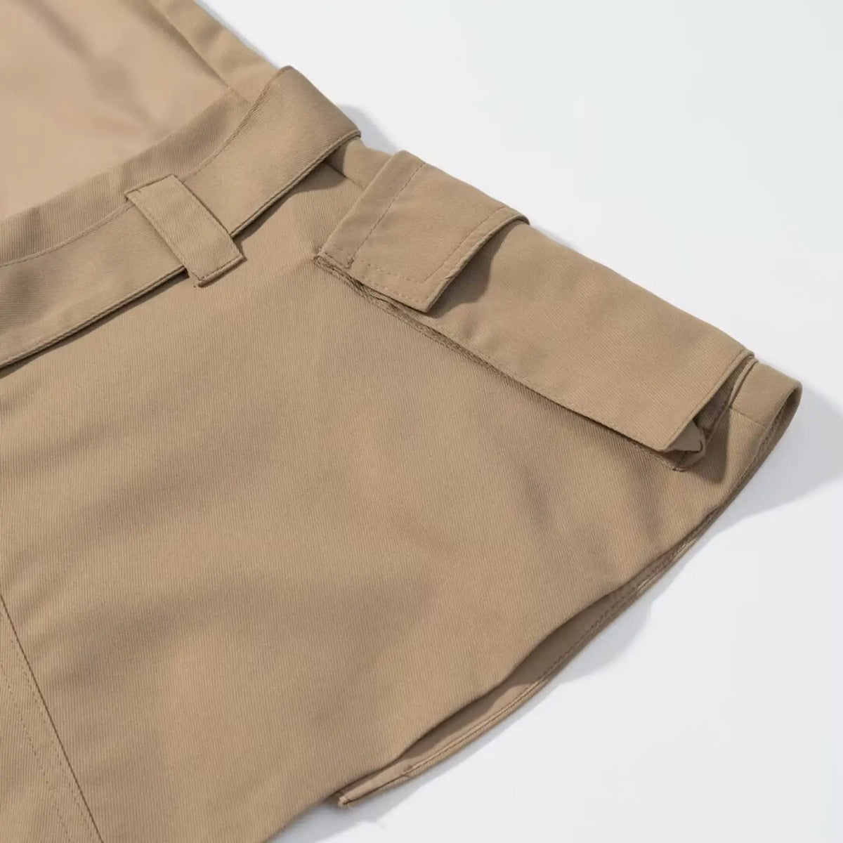 Close-up of khaki hem and side pocket