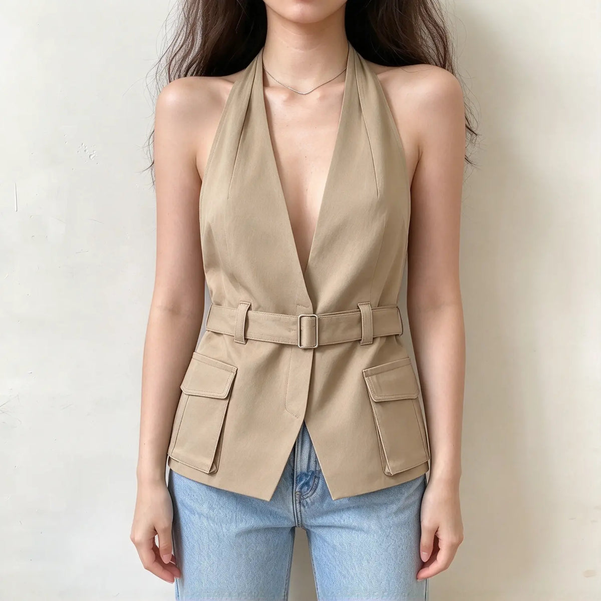 Model wearing khaki belted cargo halter vest, front view