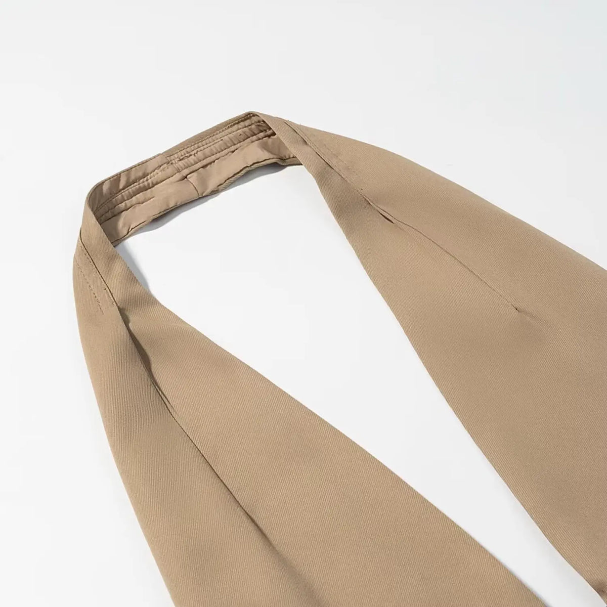 Close-up of khaki halter neck strap