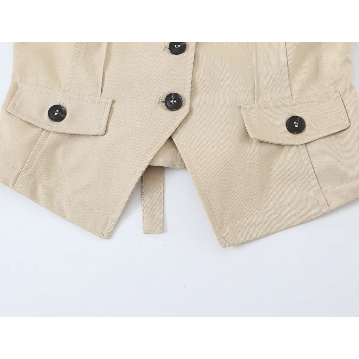Close-up of pointed hem and flap pockets