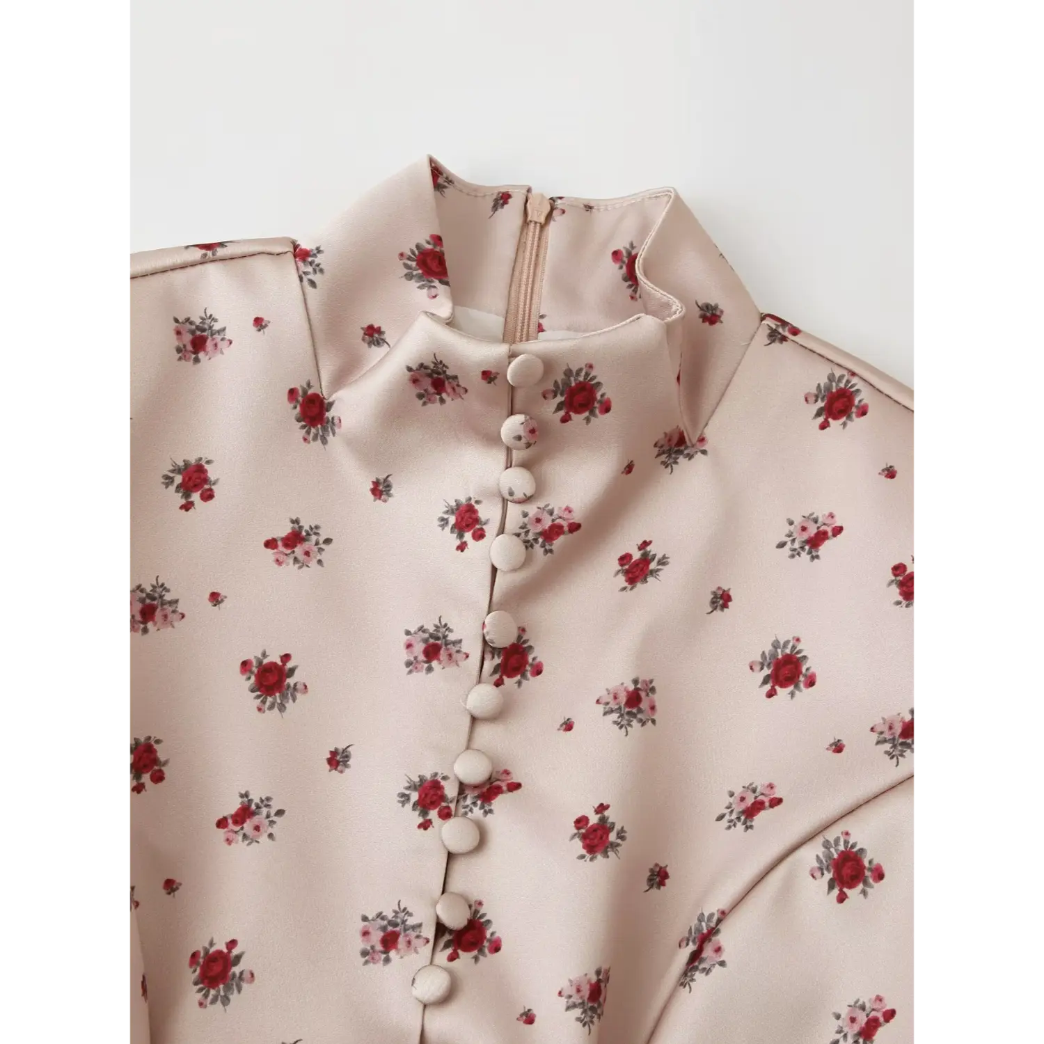 Close‑up stand collar and fabric covered button placket detail on khaki ditsy floral maxi dress