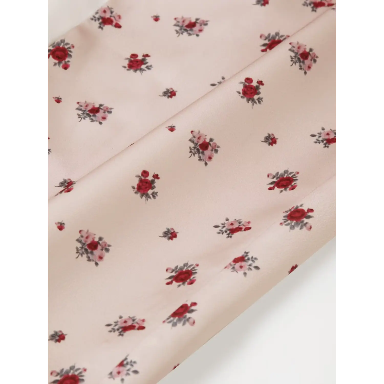 Close‑up fabric drape and ditsy rose print for khaki floral maxi dress