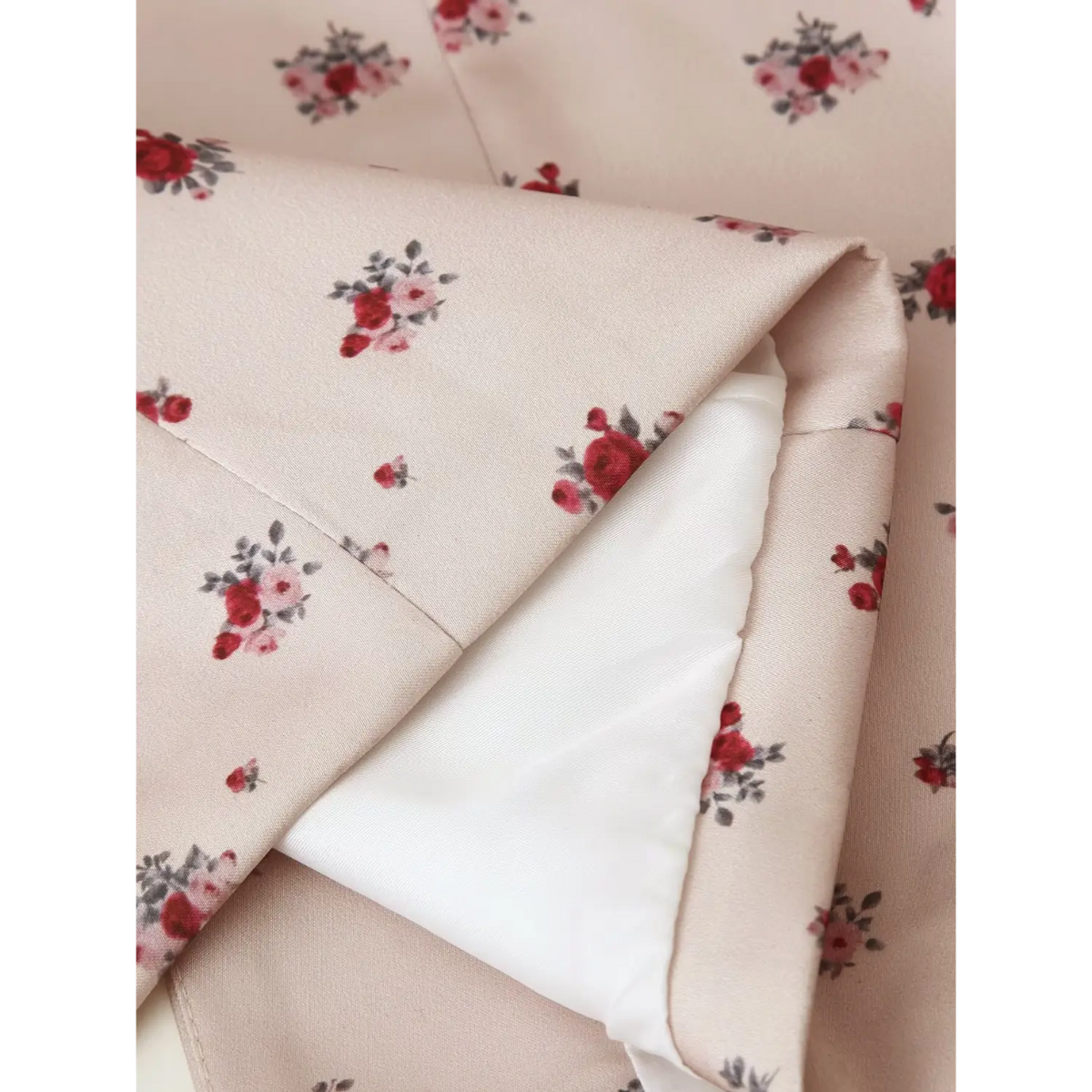 Close‑up inner lining fabric of khaki ditsy rose floral maxi dress
