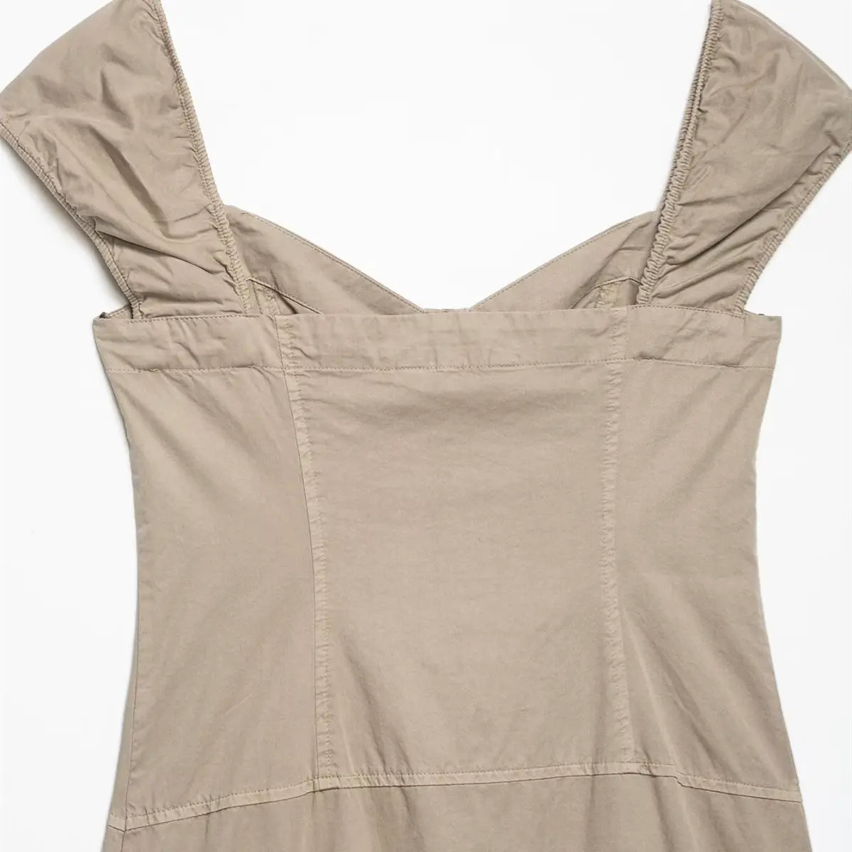 Back view of the khaki off-shoulder dress, highlighting the smooth panel and structured seams