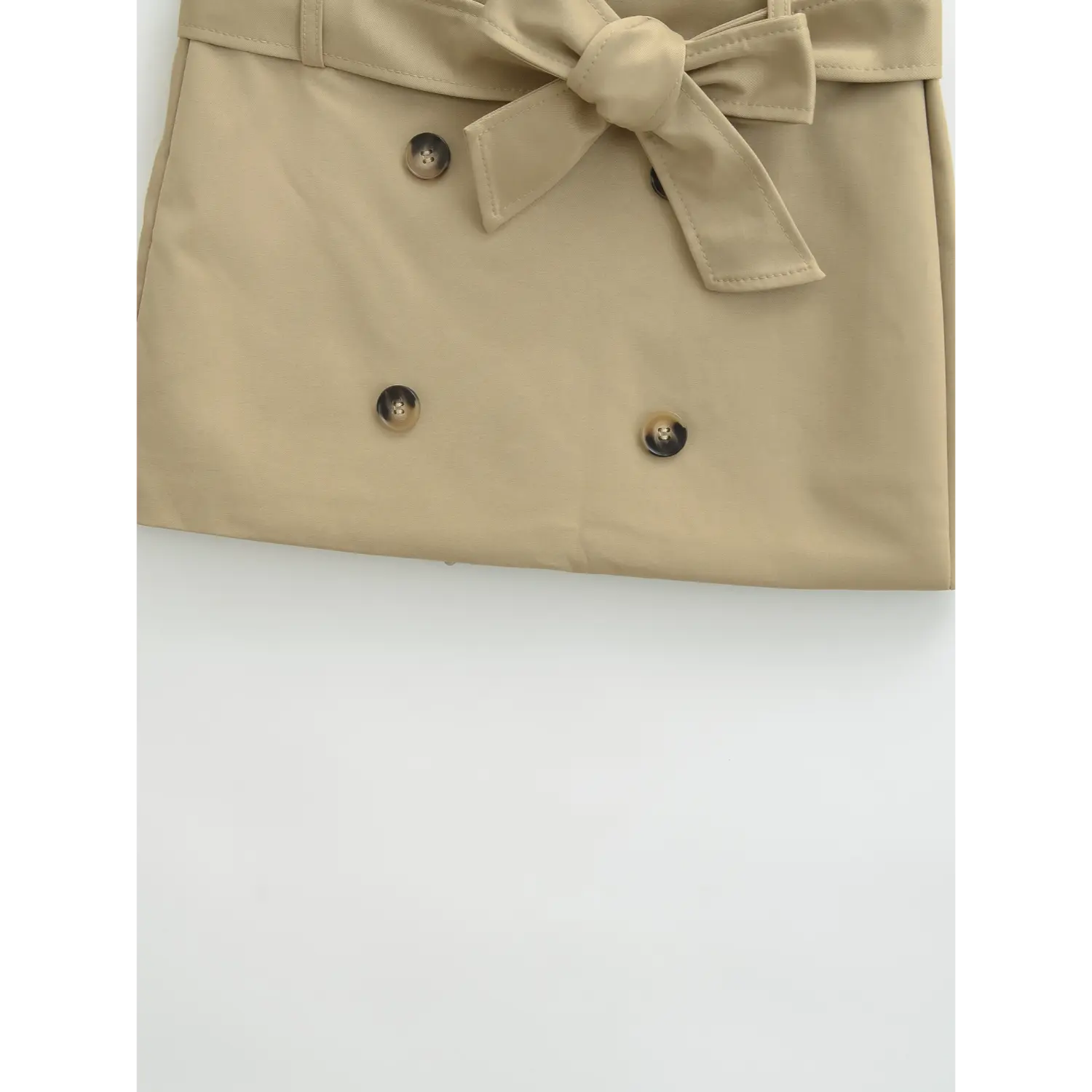 Khaki skirt front button hem flat close-up, double row gradient horn buttons smooth twill suit fabric symmetrical stitching waist cinched cut white background shot