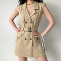 Model wearing khaki sleeveless double breasted belted mini dress