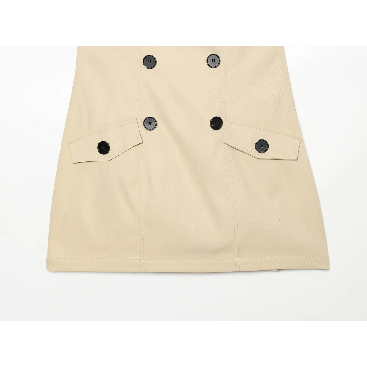 Close-up of double breasted buttons and flap pockets