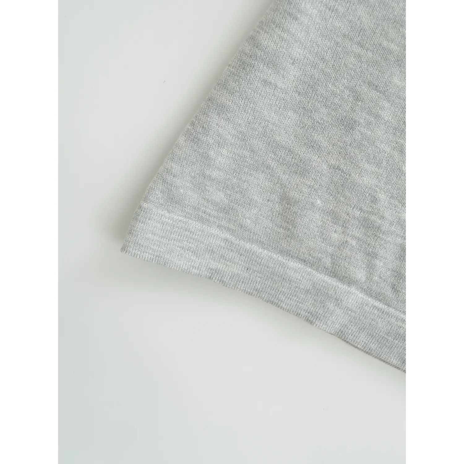 Knit tube top bottom rib binding hem flat close-up, double rib overlock neat hem high stretch anti-deformation knit fabric white background shot