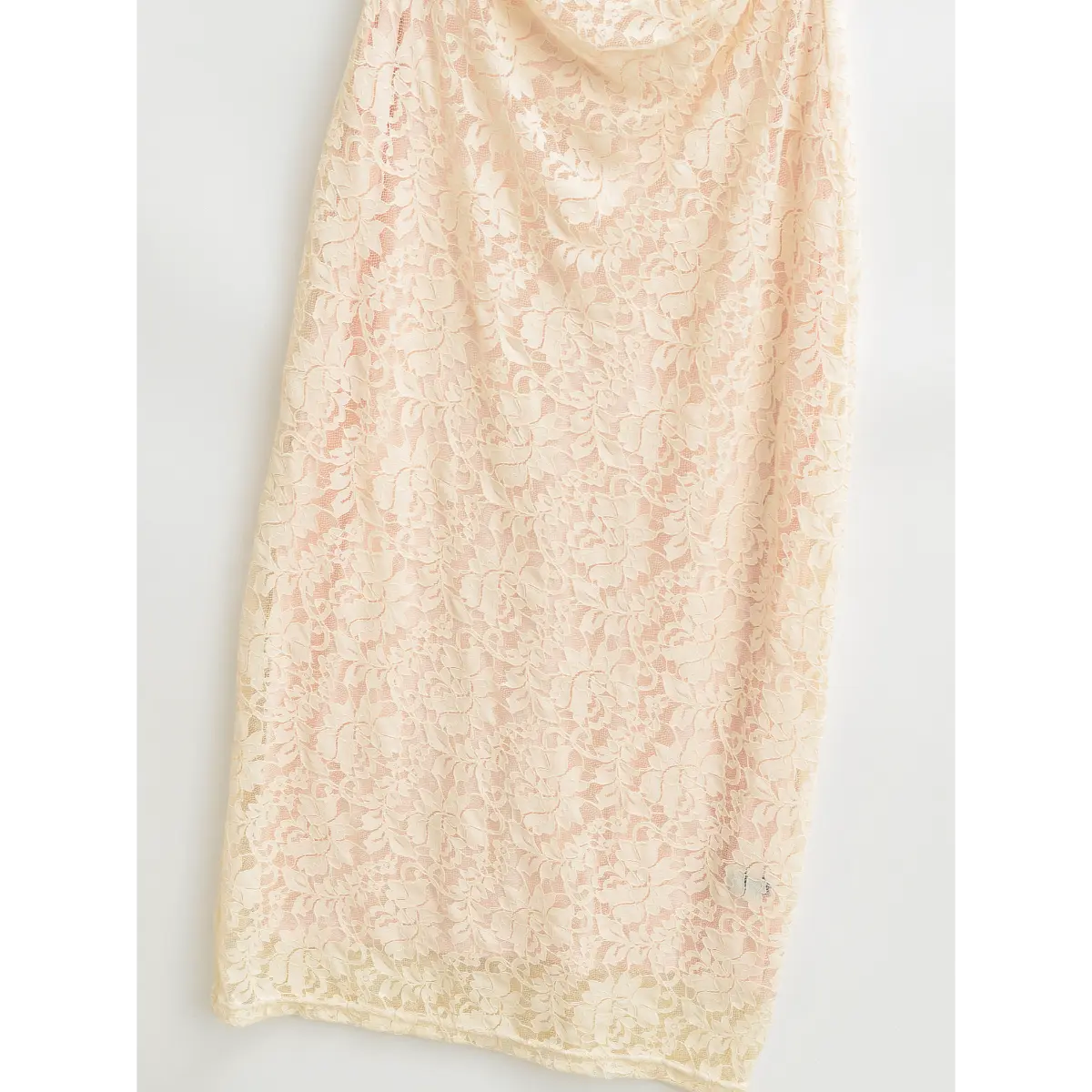 Close‑up of soft inner lining of lace bodycon maxi dress