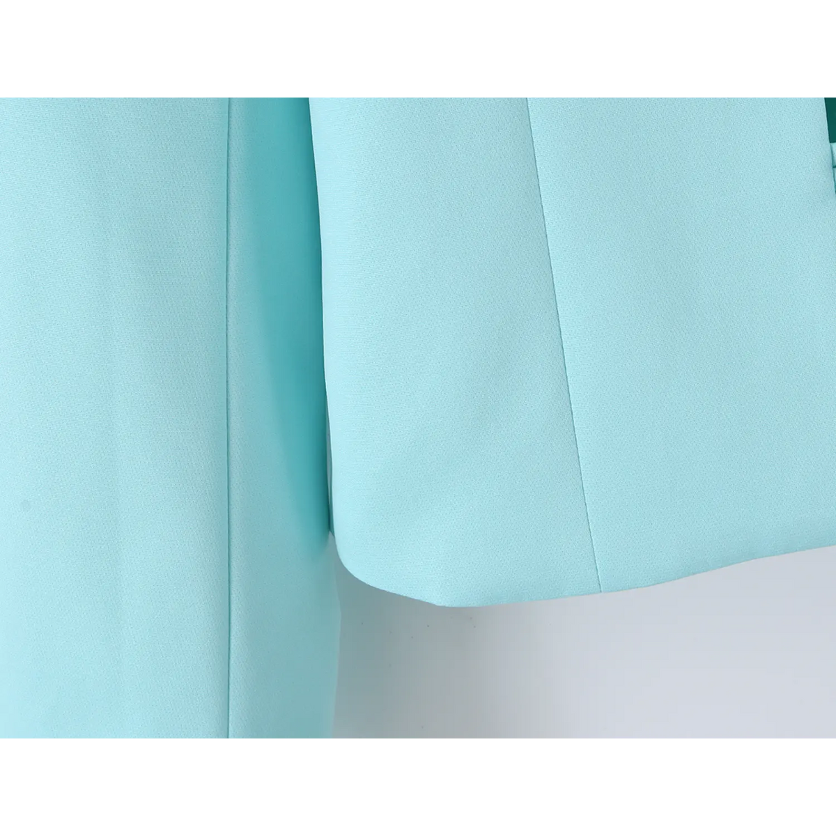 Close-up of curved cropped hem edge