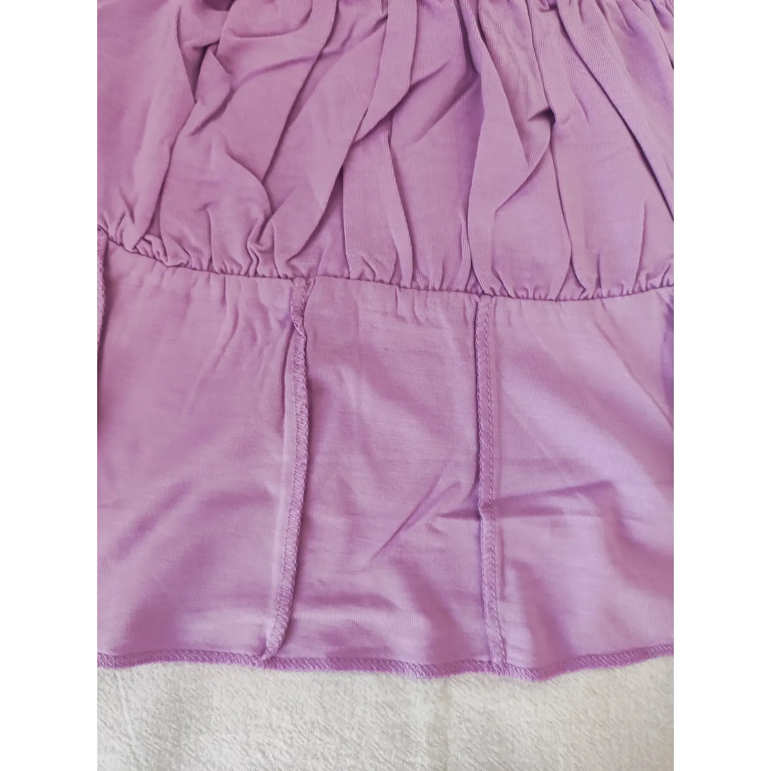 Close‑up waist vertical corset seam stitching detail of lavender ruched bust cami crop top